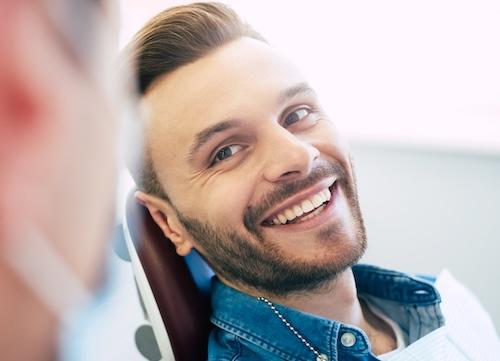 man smiling in dental chair 
