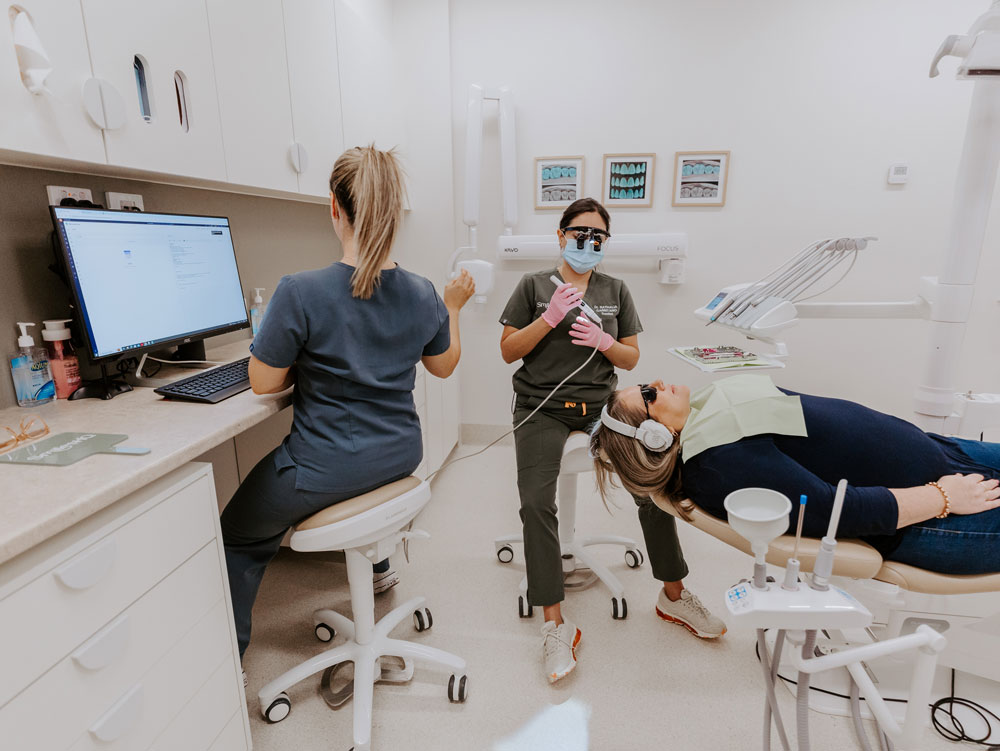 patient with headphones and sunglasses for patient comfort at smileshq