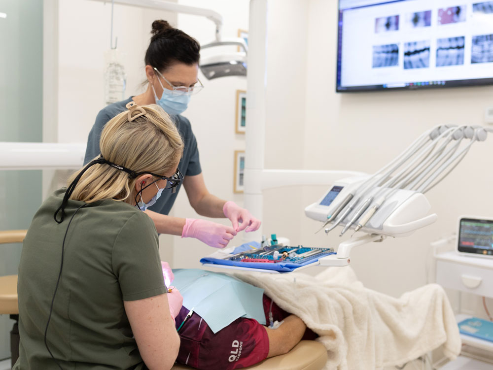 staff from smileshq working on a patient in warners bay