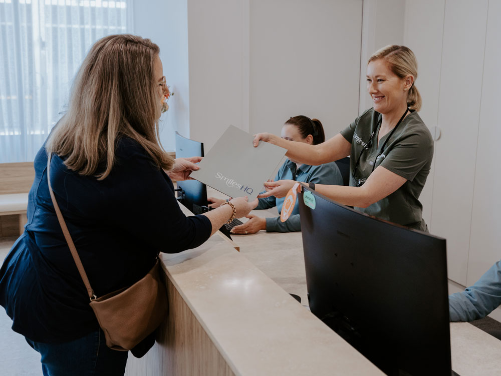 patient being welcomed at smileshq