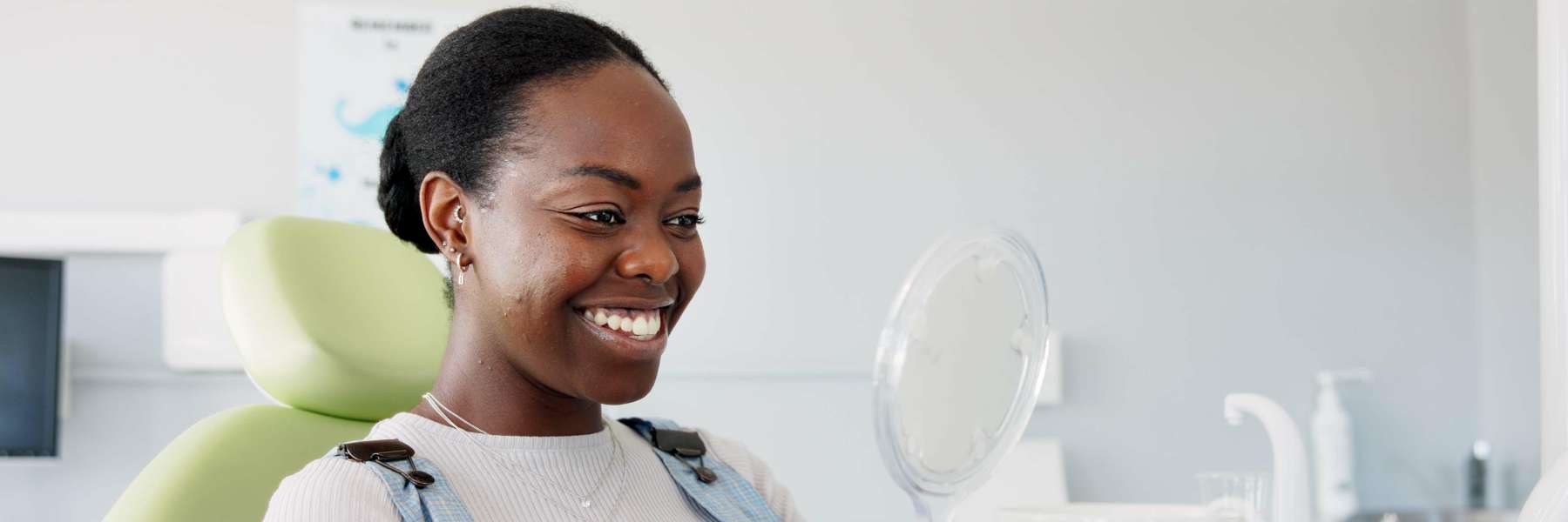 woman smiling at dentist after completing invisalign in warners bay