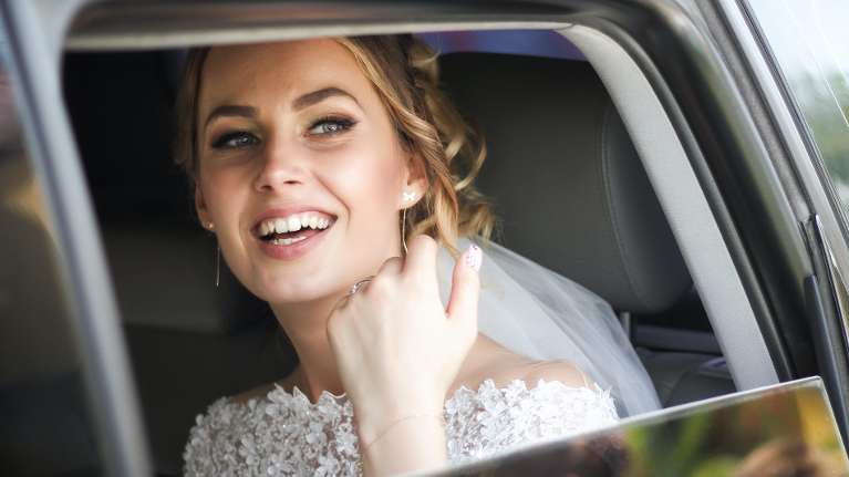newcastle bride smiling in car 