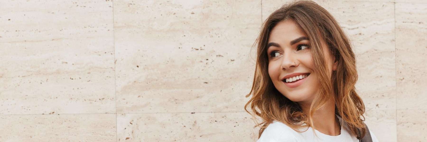 woman smiling after getting braces in newcastle