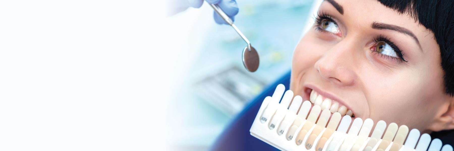 woman getting teeth matched for crowns in warners bay