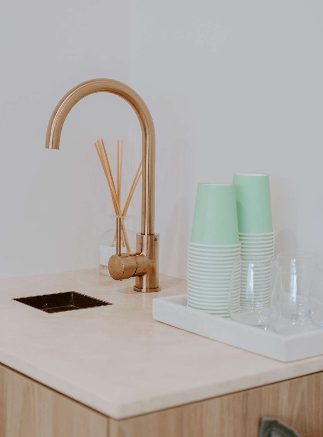 sink with water glasses next to faucet